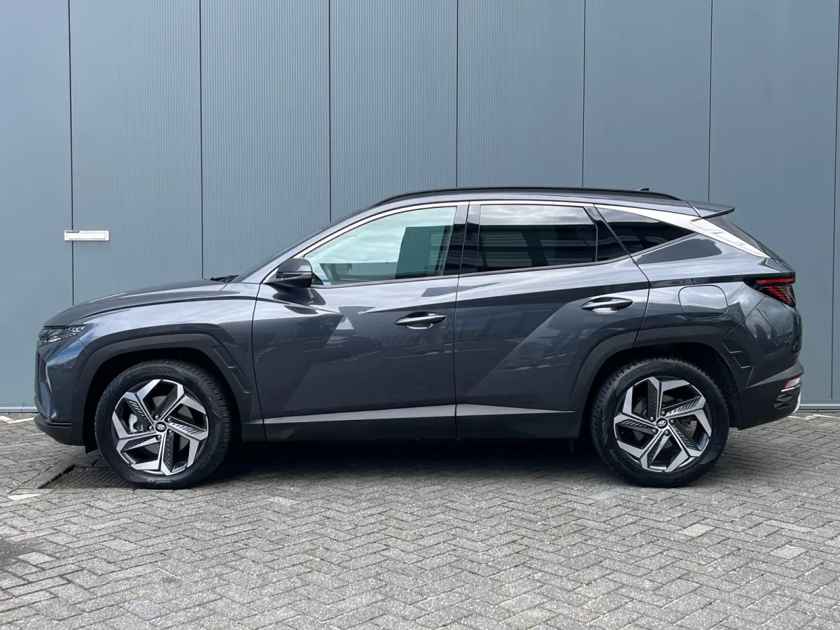 1.6 T-GDI 265pk PHEV Comfort Smart 4WD | Climate | Camera | Carplay | Keyless | Navigatie | Full - Led | Elek. Klep | Winterpakket | 19" Lichtmetaal | Digitale Cockpit | Parkeer Assistent | 