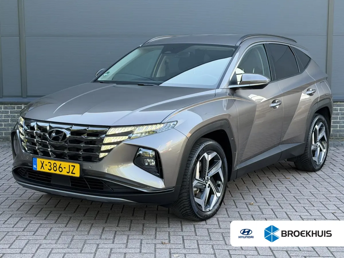 1.6 T-GDI PHEV Comfort Smart 4WD / Dealer Onderhouden / Trekhaak / SOH 100% / 1350KG Trekgewicht / Fabrieksgarantie tot 01-2029 / Stuur & Stoelverwarming / Elektrische Achterklep / Navigatie