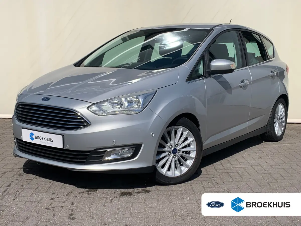 1.0 Titanium Airco | Cruise Control | DAB | Keyless | LMV 17" | Navi | Parkeerassist | PDC V&A | Voorruitverwarming |