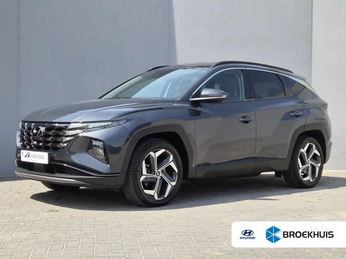 1.6 T-GDI PHEV Comfort Smart 4WD / Dealer onderhouden / Fabrieksgarantie tot 05-2027 / All season banden / Stuur- & Stoelverwarming / Trekgewicht 1350 kg / Elektrische achterklep / Achteruit