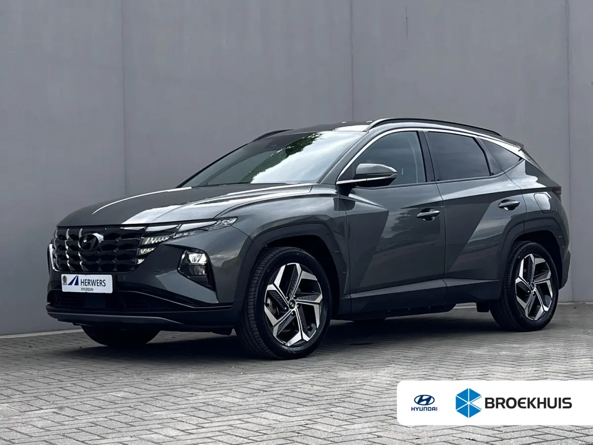 1.6 T-GDI PHEV Comfort Smart 4WD / Fabrieksgarantie tot 02-2027 / Afn. trekhaak 1.350 kg / Navigatie / Apple Carplay Android / Camera / Stuur- & stoelverwarming /19" LM wielen /