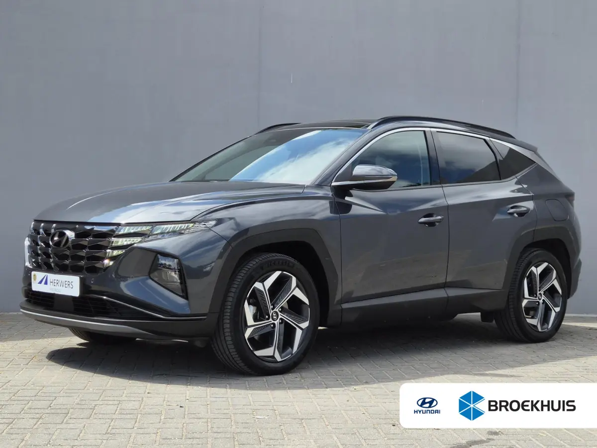 1.6 T-GDI PHEV Comfort Smart 4WD / Fabrieksgarantie tot 02-2029 / Dealer onderhouden / Glazen schuif- en kanteldak / Stuur- & Stoelverwarming / Trekgewicht 1350 kg / Achteruitrijcamera / App