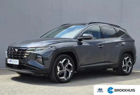 1.6 T-GDI PHEV Comfort Smart 4WD / Fabrieksgarantie tot 02-2029 / Dealer onderhouden / Glazen schuif- en kanteldak / Stuur- & Stoelverwarming / Trekgewicht 1350 kg / Achteruitrijcamera / App