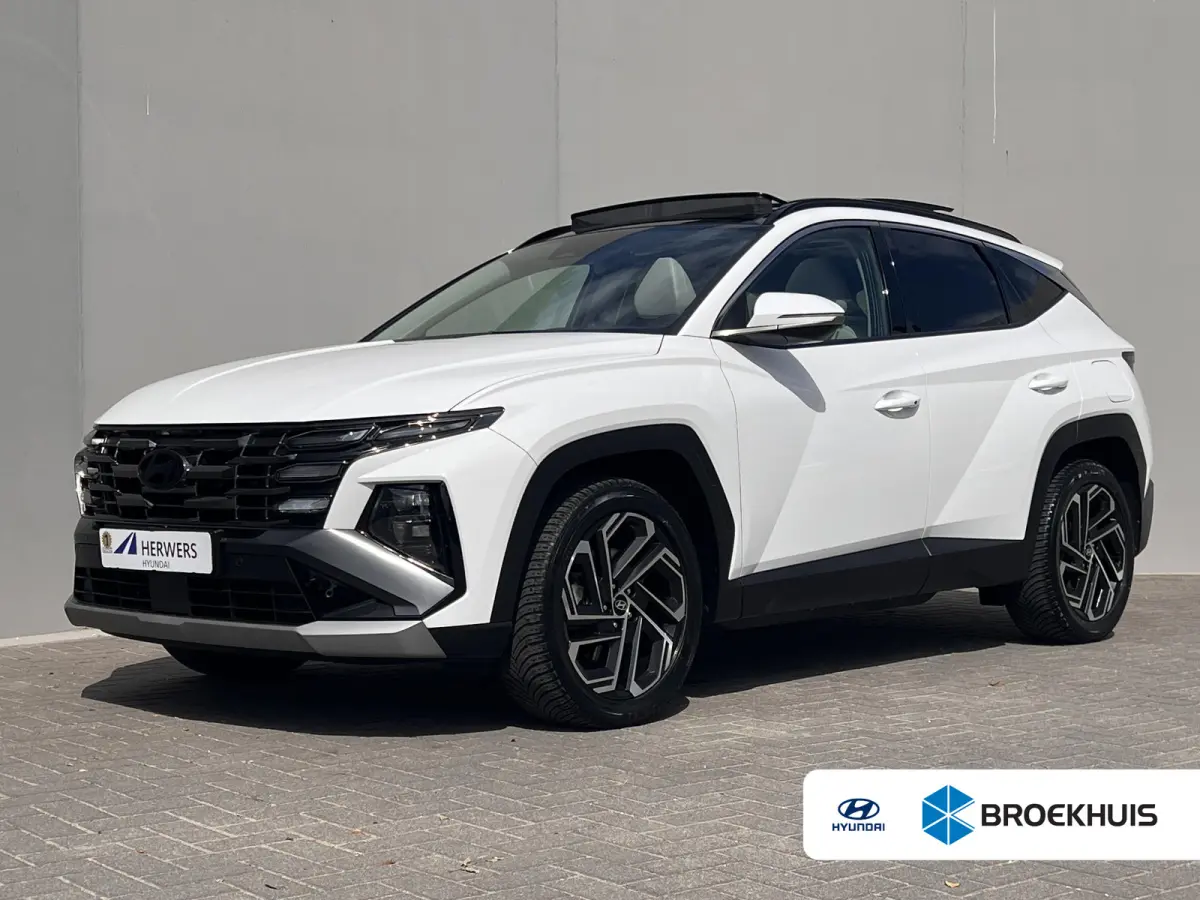 1.6 T-GDI PHEV Premium Sky 4WD / Accu SoH 100 % / Panorama schuifdak / Wit leder / HUD / Camera / Elektr. stoelen & klep / Stoelventilatie / Stuur-, stoel- en achterbankverwarming /19" LM wi