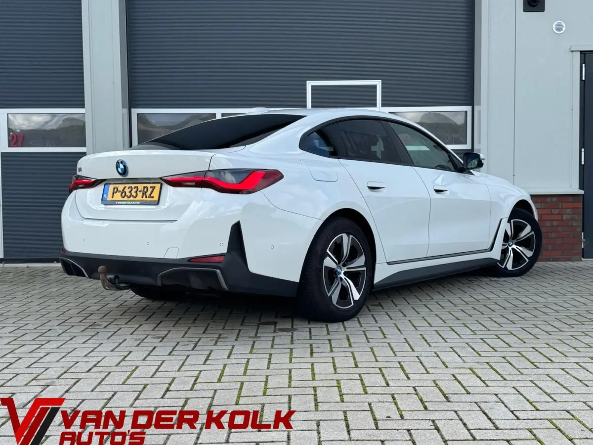 eDrive40 High Executive 84 kWh | half Leder | Camera | Full LED | CarPlay | DAB+ | Cruise | Climate | Navigatie