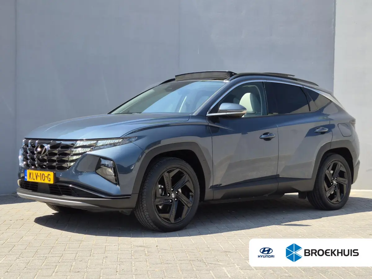 1.6 T-GDI PHEV Premium Sky 4WD / Glazen schuif- en kanteldak / Rondomzicht camera / Trekgewicht 1.350 kg / Elektrische achterklep / Stuur- Stoel & Achterbank verwarming / Adaptief cruise con
