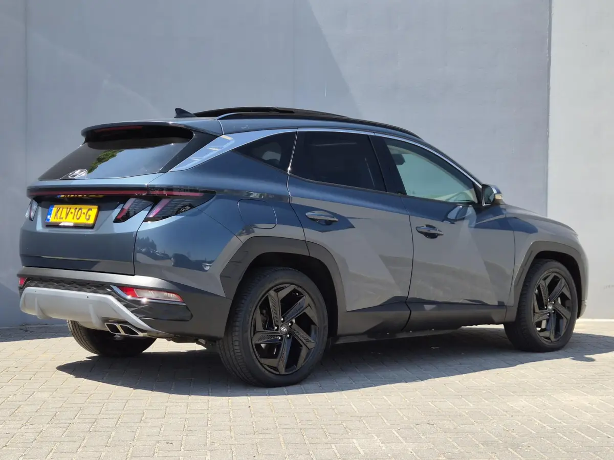 1.6 T-GDI PHEV Premium Sky 4WD / Glazen schuif- en kanteldak / Rondomzicht camera / Trekgewicht 1.350 kg / Elektrische achterklep / Stuur- Stoel & Achterbank verwarming / Adaptief cruise con