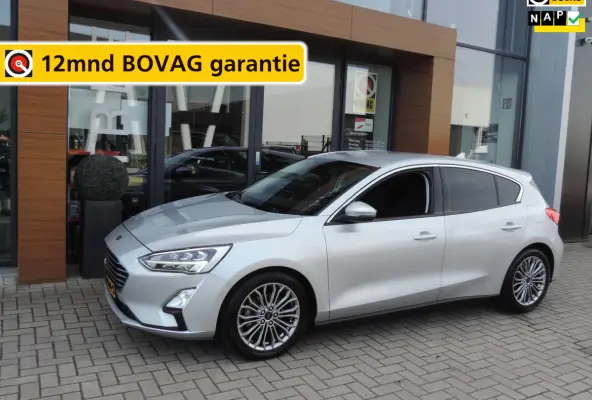 1.0-T 125PK Titanium Business | LED koplamp | Winterpack | Camera | Adapt.cruise | PDC v+a | CarPlay | Priv.glas | ECC