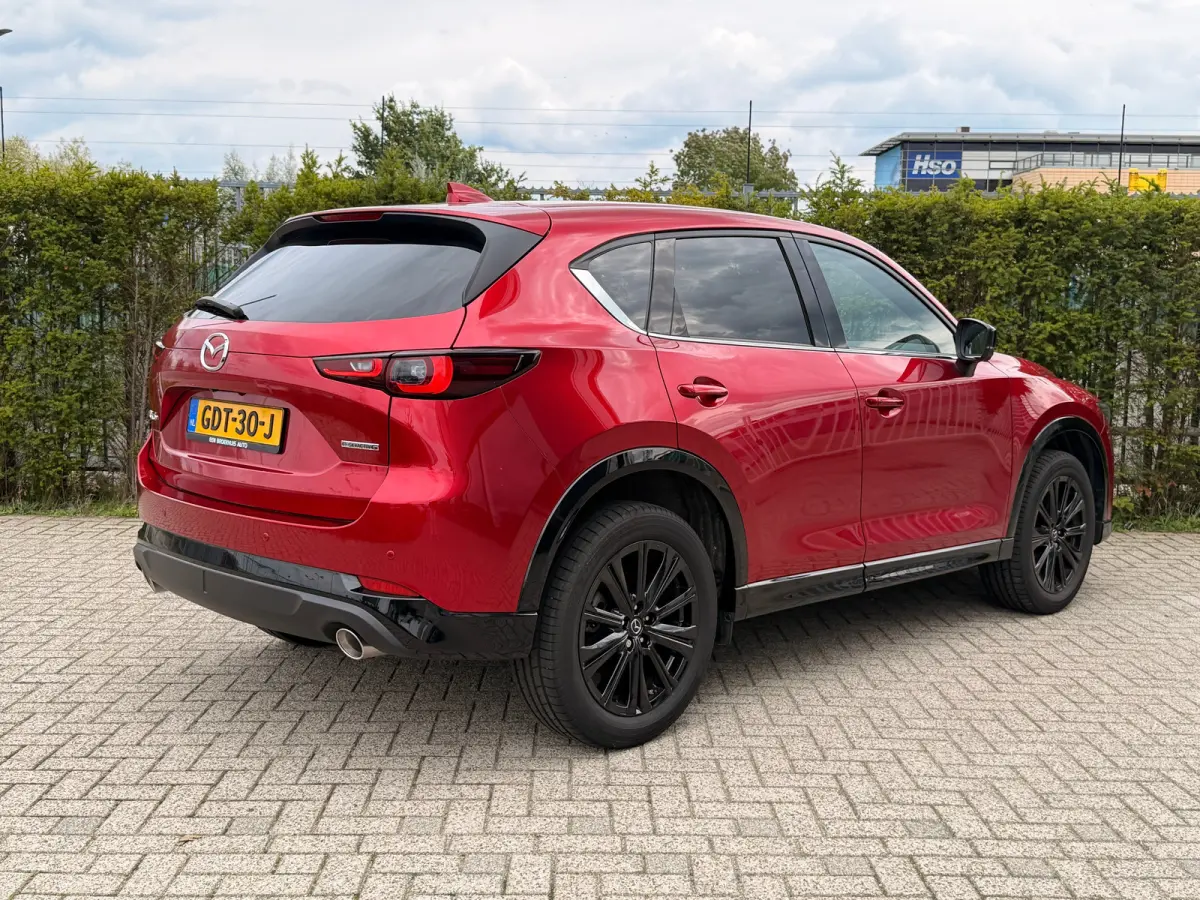 2.0 e-SkyActiv-G M Hybrid 165 Homura | NL-Auto | Adapt. Cruise | Bose Audio | Head-up | Stoel+Stuurverwarming | 360 Camera | Elektr. stoel | Keyless | Elektr. Klep