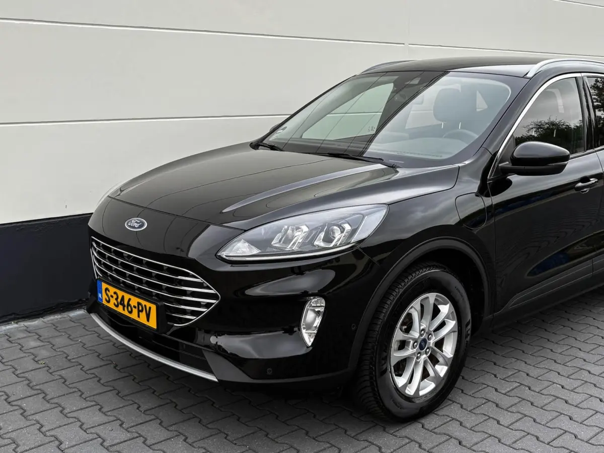2.5 PHEV 225pk Titanium | Navigatie | Assist pakket | Camera | Trekhaak