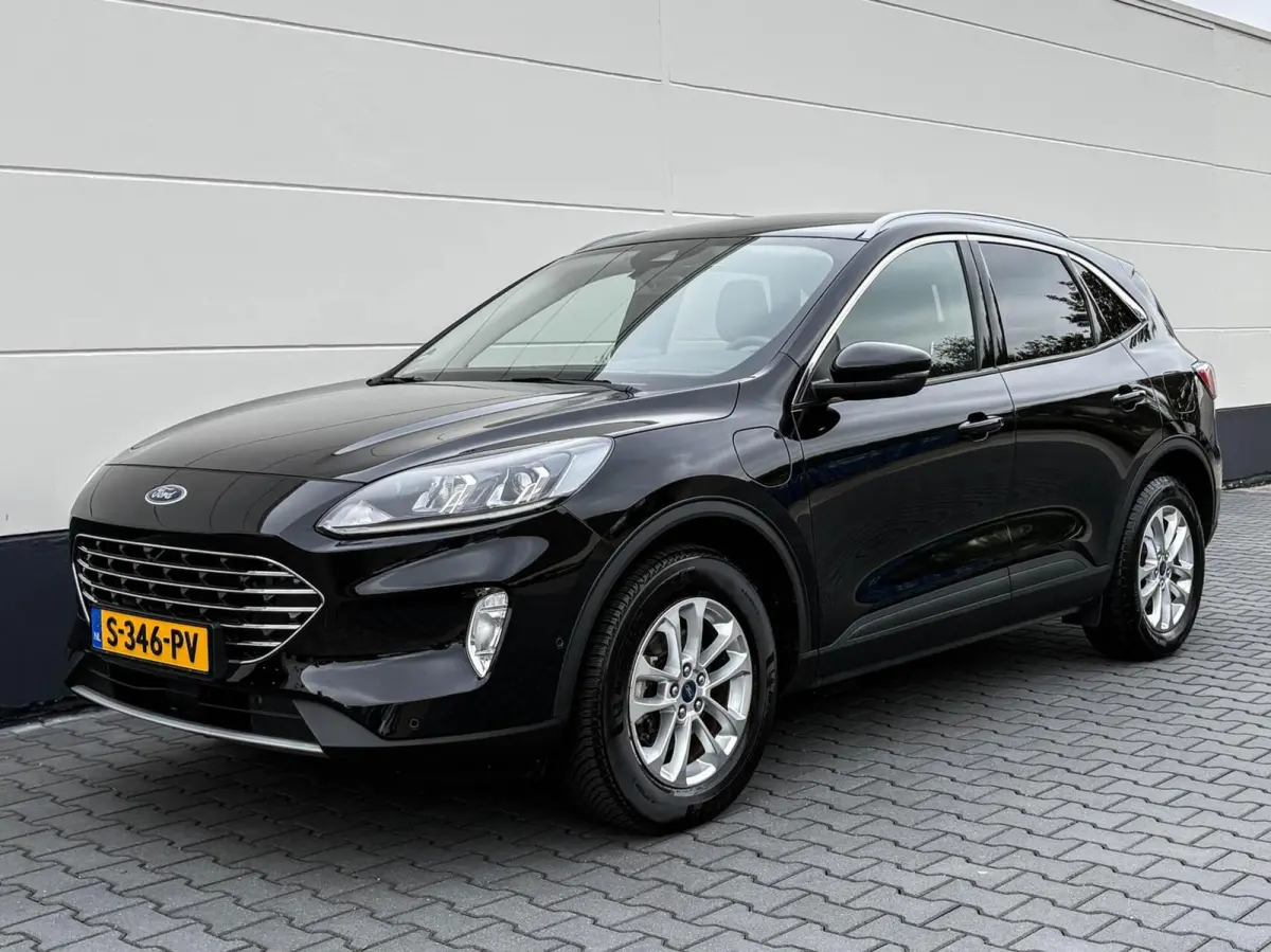 2.5 PHEV 225pk Titanium | Navigatie | Assist pakket | Camera | Trekhaak
