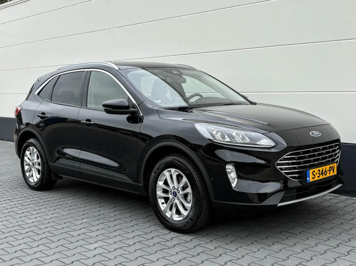 2.5 PHEV 225pk Titanium | Navigatie | Assist pakket | Camera | Trekhaak