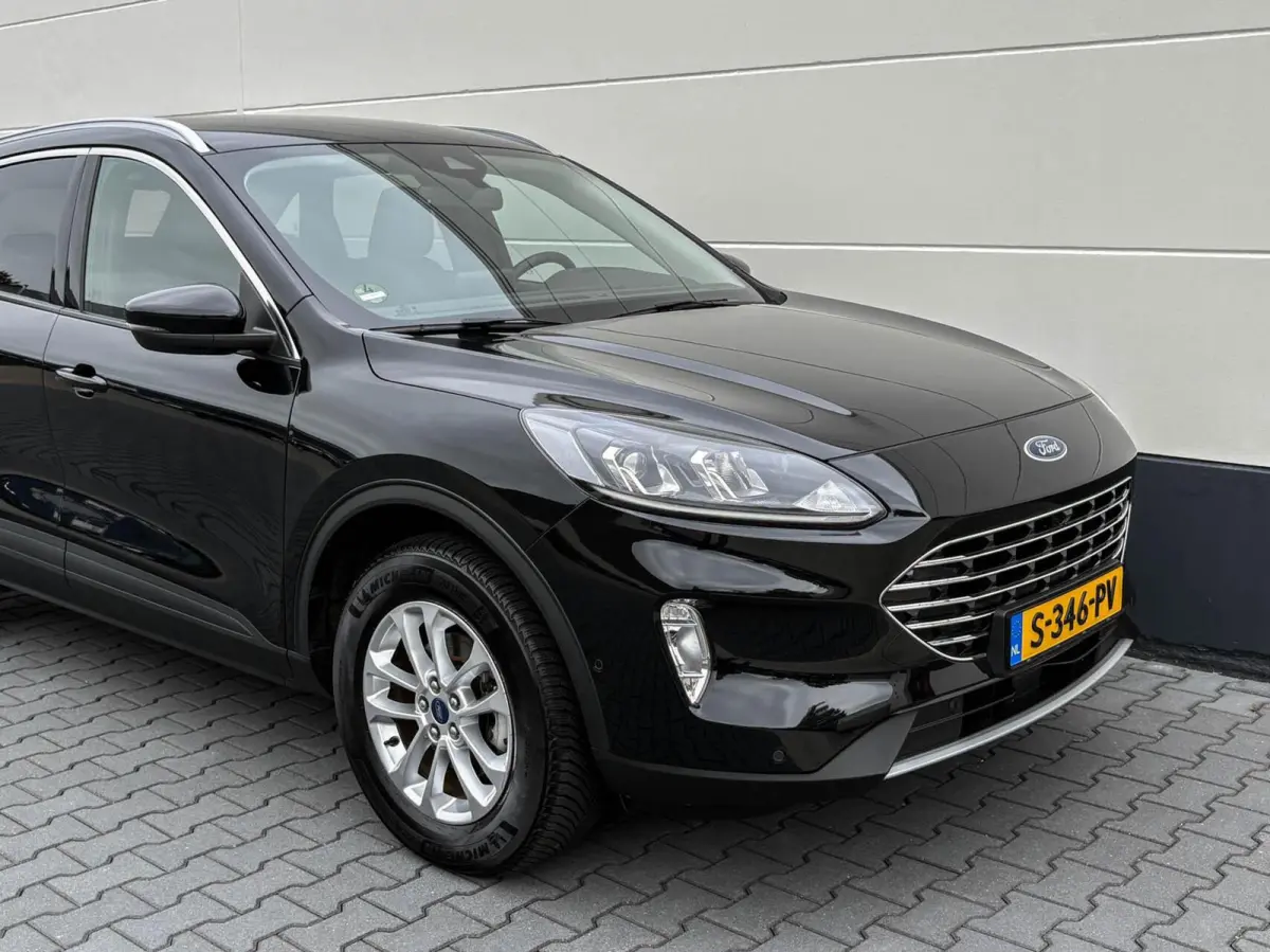 2.5 PHEV 225pk Titanium | Navigatie | Assist pakket | Camera | Trekhaak