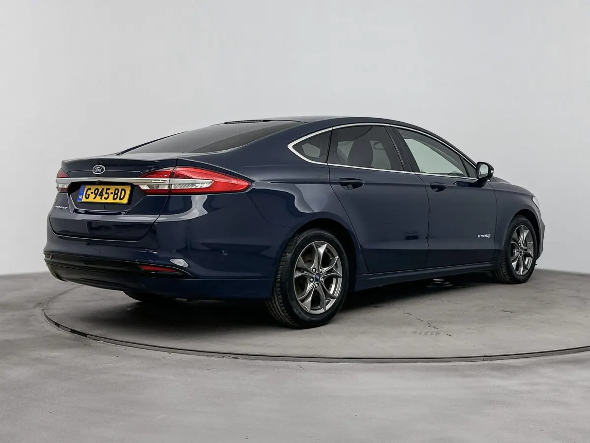 2.0 IVCT HEV Titanium | Achteruitrijcamera | Cruise Control | Navigatie | lichtmetalen velgen 16" |