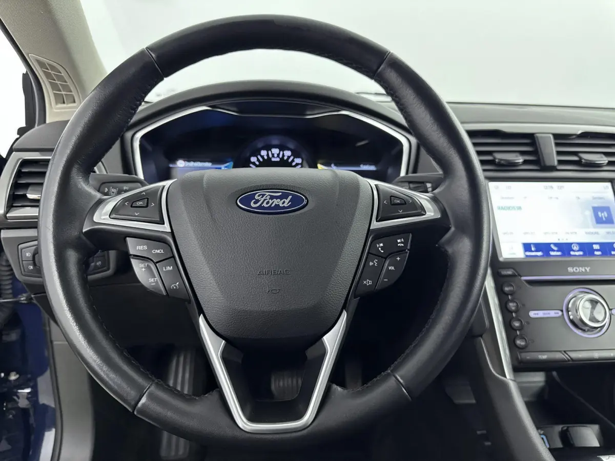 2.0 IVCT HEV Titanium | Achteruitrijcamera | Cruise Control | Navigatie | lichtmetalen velgen 16" |