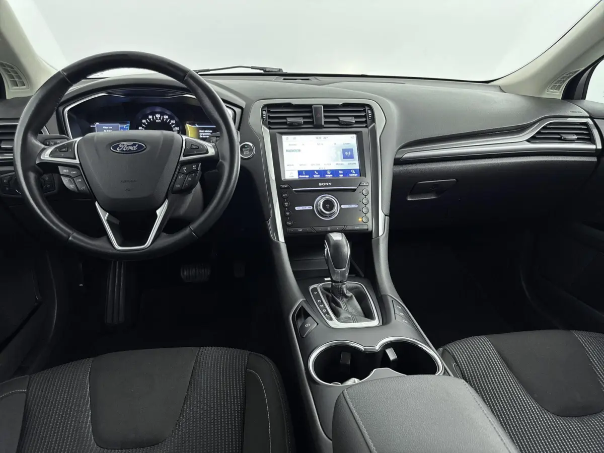2.0 IVCT HEV Titanium | Achteruitrijcamera | Cruise Control | Navigatie | lichtmetalen velgen 16" |