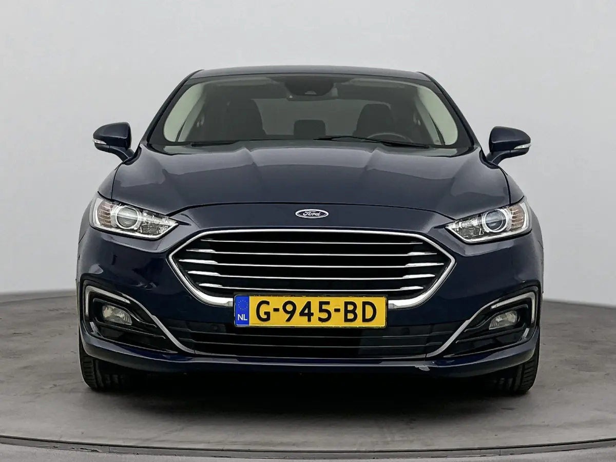 2.0 IVCT HEV Titanium | Achteruitrijcamera | Cruise Control | Navigatie | lichtmetalen velgen 16" |