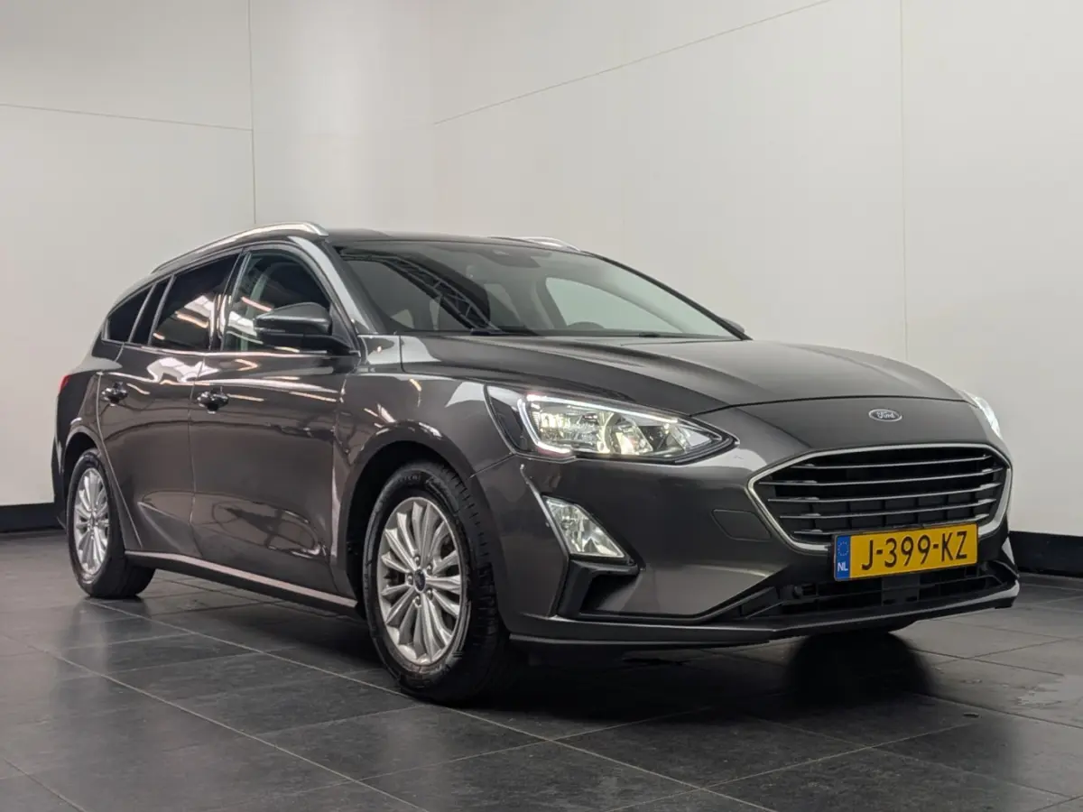 1.0EB Hybrid Titanium X Business | NL-AUTO! | 1E EIGENAAR! | TREKHAAK | CAMERA | CRUISE | NAVI | PARK SENS V+A | LANE ASSIST | DEALER OH! | ELEKTR. KOFFERBAK