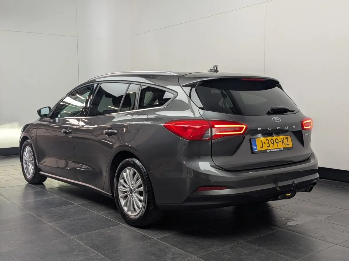 1.0EB Hybrid Titanium X Business | NL-AUTO! | 1E EIGENAAR! | TREKHAAK | CAMERA | CRUISE | NAVI | PARK SENS V+A | LANE ASSIST | DEALER OH! | ELEKTR. KOFFERBAK