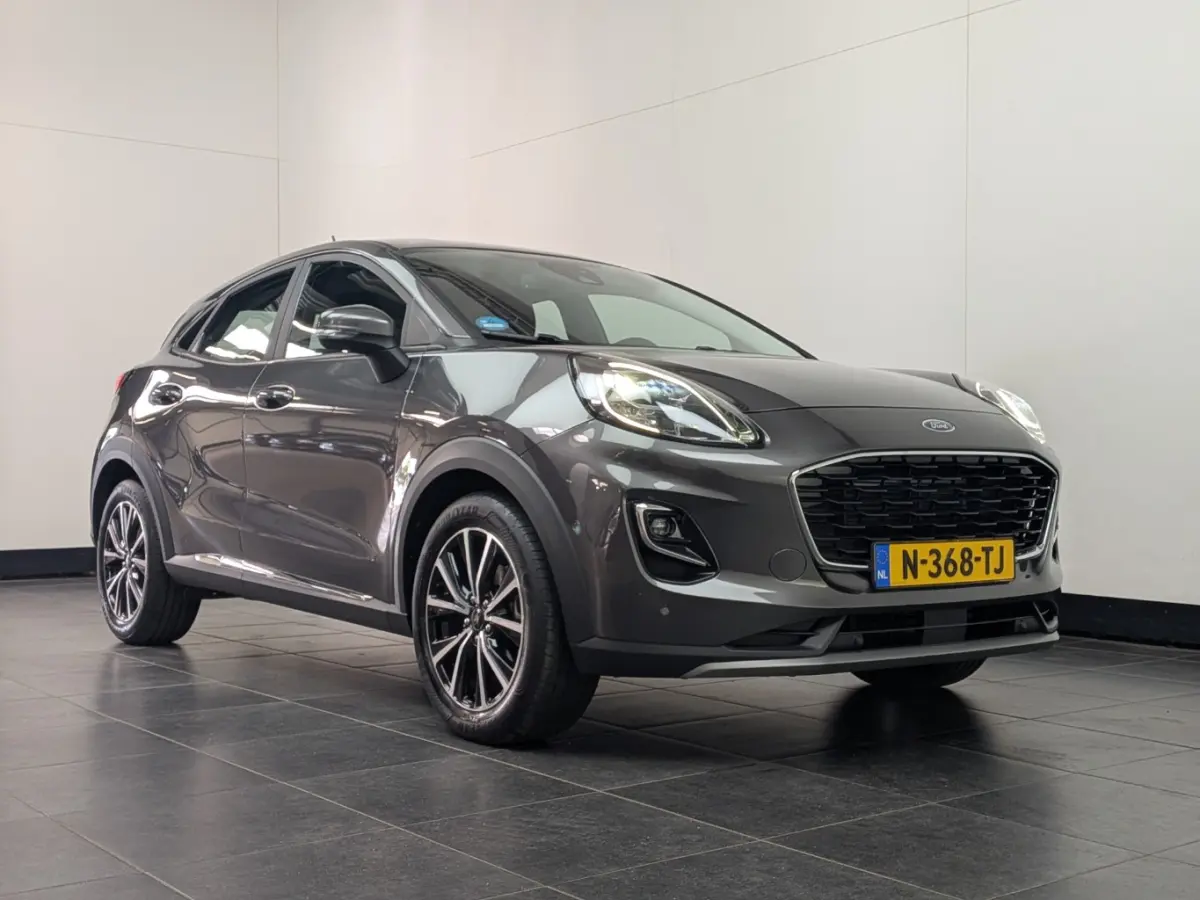 1.0EB Titanium | NL-AUTO! | 1E EIGENAAR! | WINTERPACK | TREKHAAK | ADAPTIVE CRUISE | DODE HOEK | CAMERA | PARK SENS V+A | DEALER OH! | LANE ASSIST