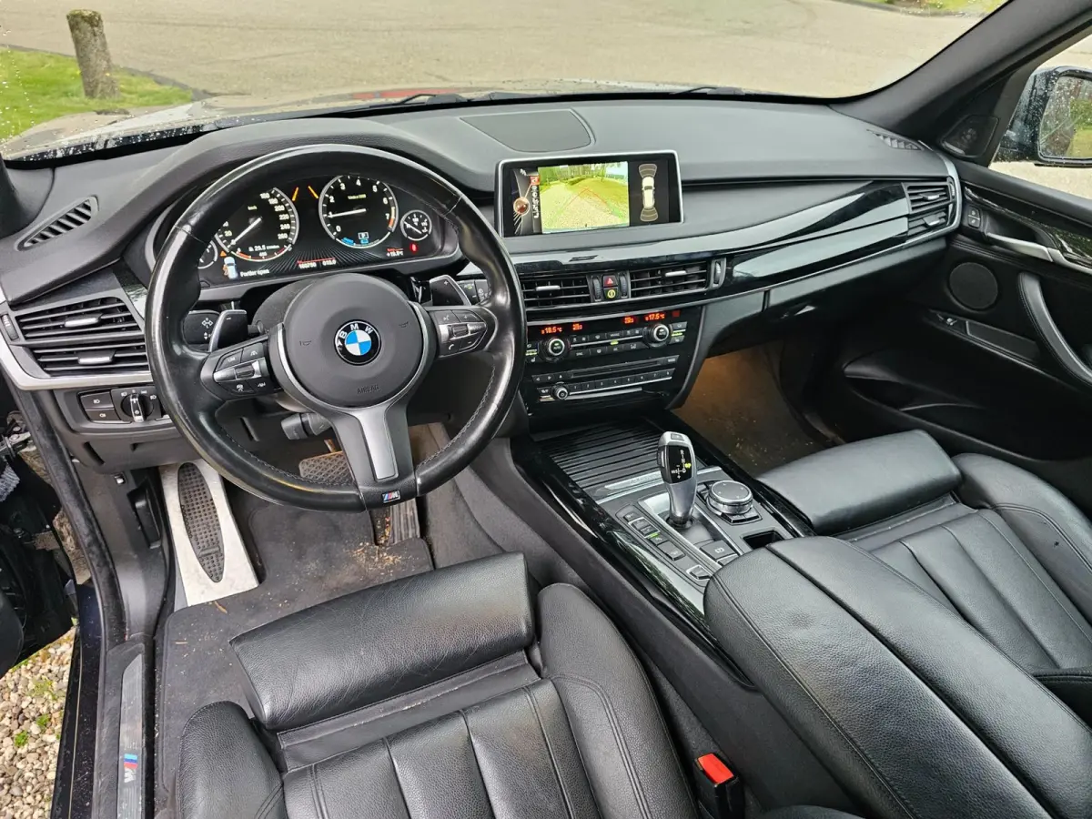 XDrive40e High Executive M-sport dealer onderhouden