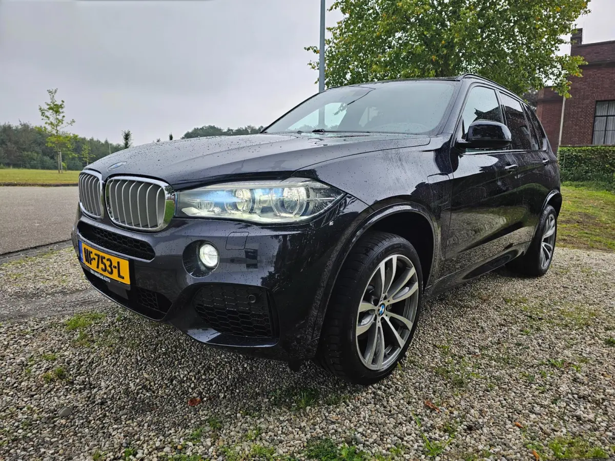 XDrive40e High Executive M-sport dealer onderhouden