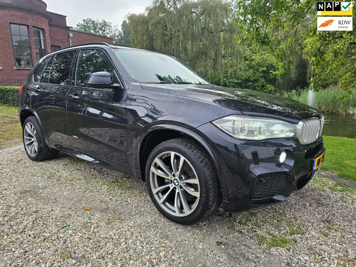 XDrive40e High Executive M-sport dealer onderhouden