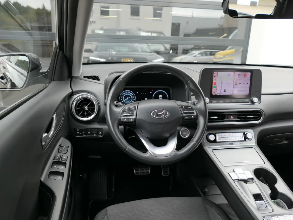 EV Comfort 64 kWh | Apple-/Android Carplay | Achteruitrijcamera | Digitaal dashboard | Stuur-/Stoelverwarming | Climate Control | ACC | 1e eigenaar | Dealer onderhouden