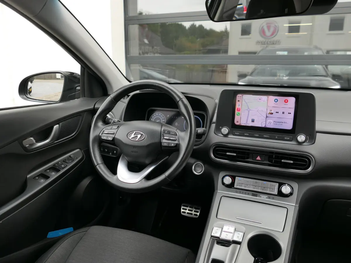 EV Comfort 64 kWh | Apple-/Android Carplay | Achteruitrijcamera | Digitaal dashboard | Stuur-/Stoelverwarming | Climate Control | ACC | 1e eigenaar | Dealer onderhouden