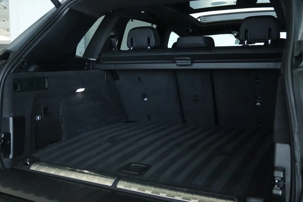 xDrive50e M-Sport Pro | Adapt. Cruise | Competition Stoelen | Carbon | Massage | Softclose | 4-wielsturing | Trekhaak | Pano | Harman & Kardon | HUD