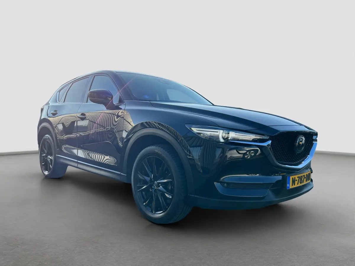 2.0 SkyActiv-G 165 Newground Automaat | 360 graden camera | Adaptive cruise control | Elektrische achterklep | Bestuurdersstoel met geheugen | Half leder | Stoelverwarming | Dodehoek detecti