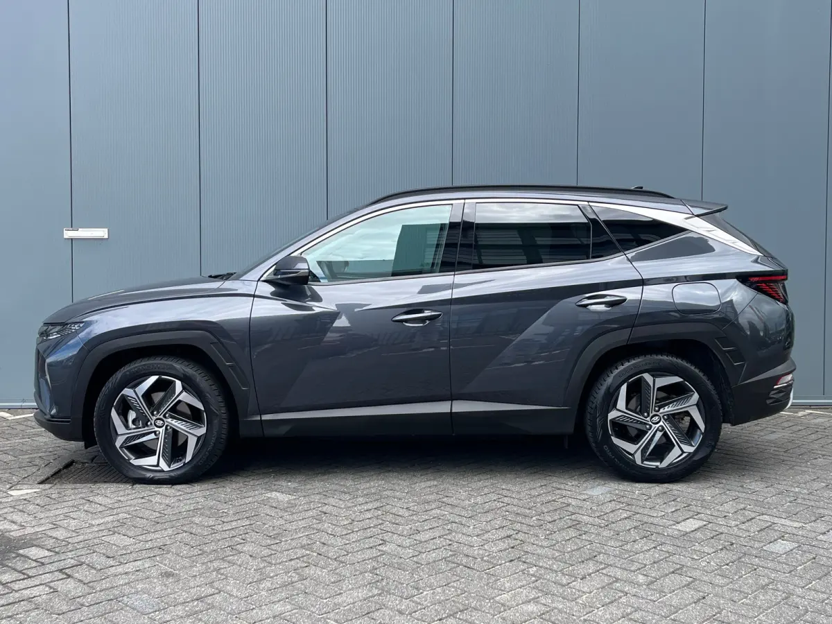 1.6 T-GDI 265pk PHEV Comfort Smart 4WD | Climate | Camera | Carplay | Keyless | Navigatie | Full - Led | Elek. Klep | Winterpakket | 19" Lichtmetaal | Digitale Cockpit | Parkeer Assistent | 
