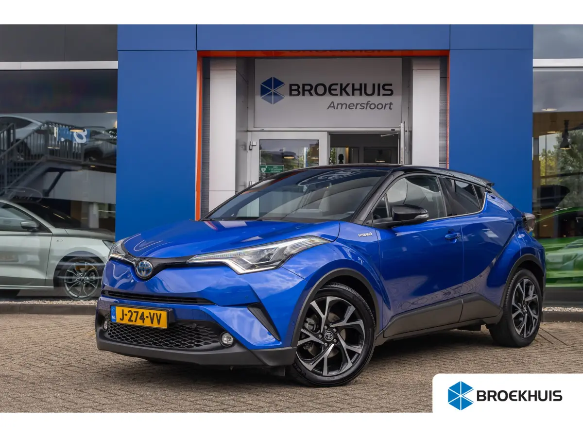 1.8 Hybrid Bi-Tone | Cruise control adaptief | Cruise Control | Stoelverwarming | Parkeersensoren Voor/Achter | | Achteruitrijcamera | Cruise control adaptief | Lichtmetalen velgen 18"