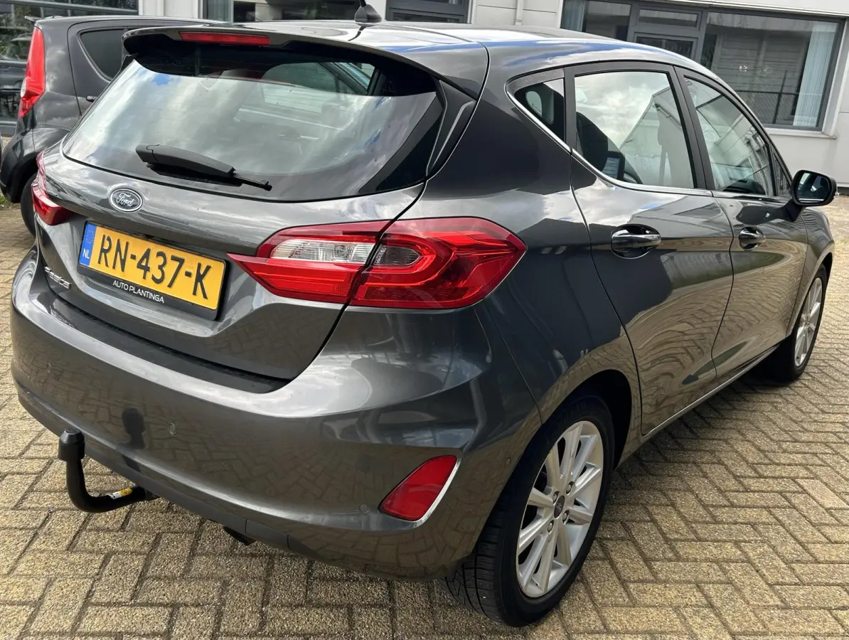 1.0 EcoBoost Titanium 101PK | 1e Eigenaar! | Dealeronderhouden | NL AUTO | AUTOMAAT | Trekhaak | Achteruitrijcamera | B&O Audio | Navigatie | Climate Control | Adaptive Cruise Control | Voor
