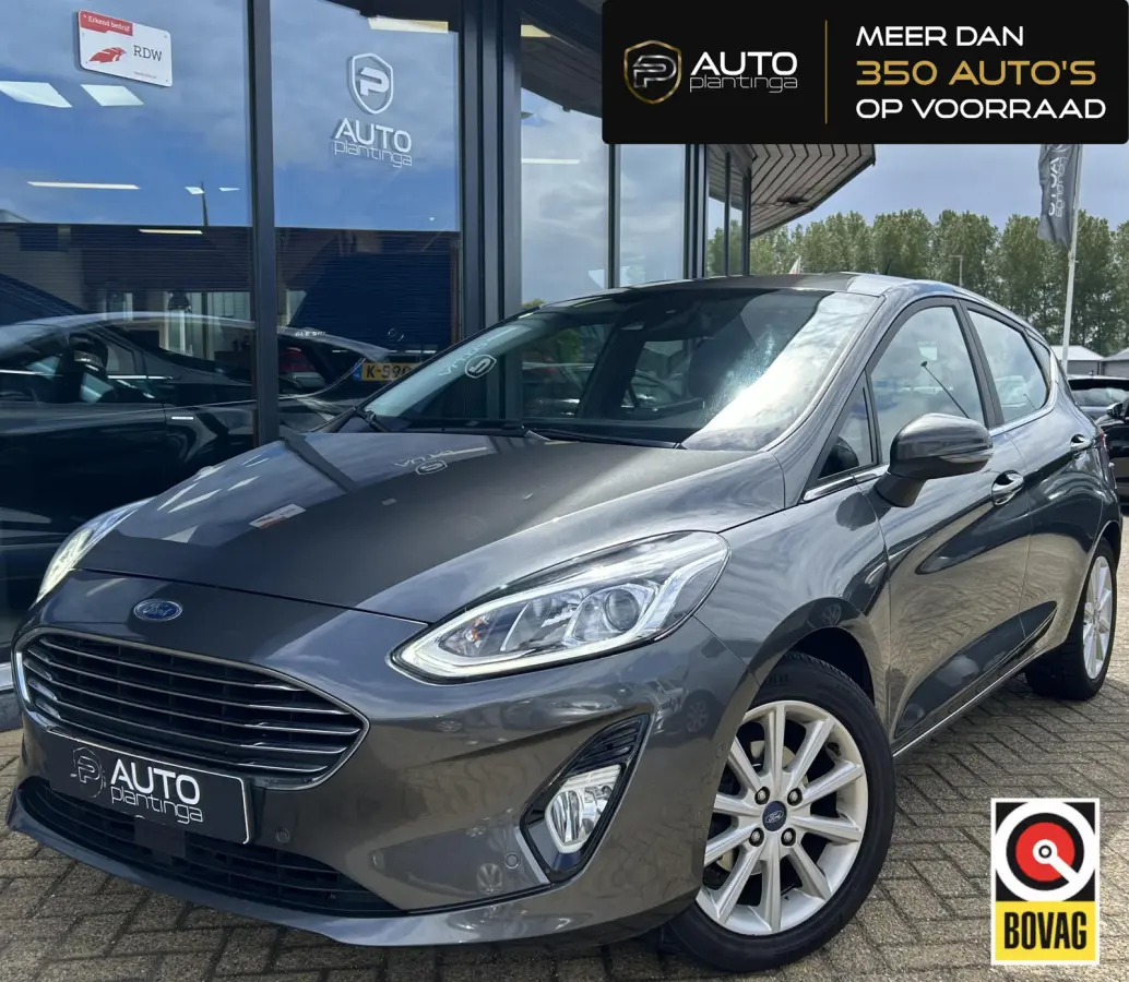 1.0 EcoBoost Titanium 101PK | 1e Eigenaar! | Dealeronderhouden | NL AUTO | AUTOMAAT | Trekhaak | Achteruitrijcamera | B&O Audio | Navigatie | Climate Control | Adaptive Cruise Control | Voor