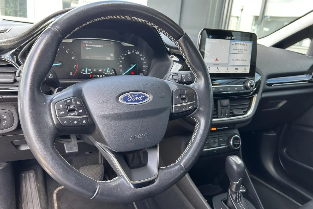1.0 EcoBoost Titanium 101PK | 1e Eigenaar! | Dealeronderhouden | NL AUTO | AUTOMAAT | Trekhaak | Achteruitrijcamera | B&O Audio | Navigatie | Climate Control | Adaptive Cruise Control | Voor