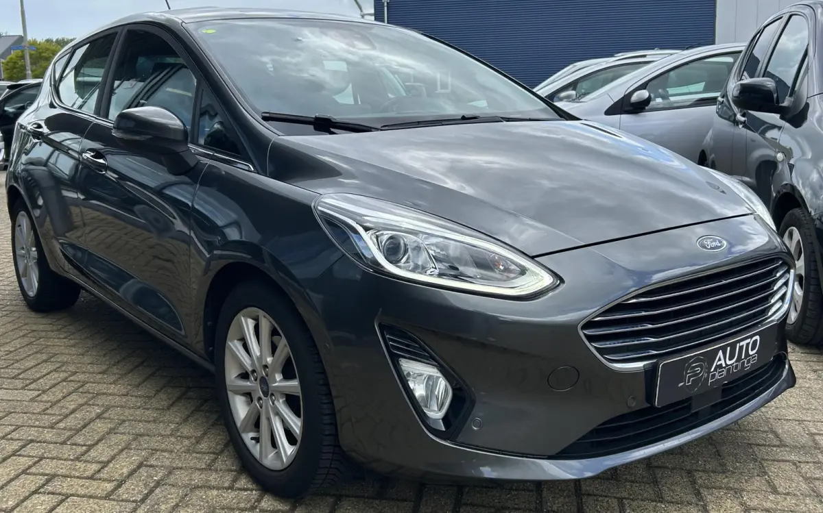 1.0 EcoBoost Titanium 101PK | 1e Eigenaar! | Dealeronderhouden | NL AUTO | AUTOMAAT | Trekhaak | Achteruitrijcamera | B&O Audio | Navigatie | Climate Control | Adaptive Cruise Control | Voor