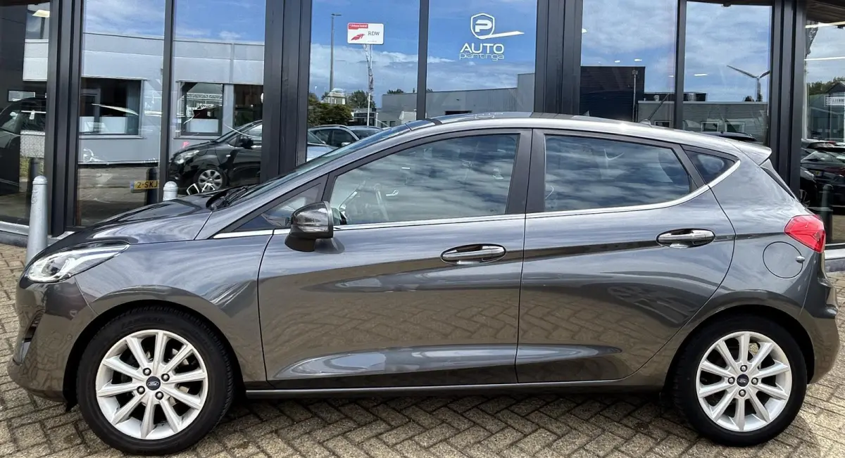 1.0 EcoBoost Titanium 101PK | 1e Eigenaar! | Dealeronderhouden | NL AUTO | AUTOMAAT | Trekhaak | Achteruitrijcamera | B&O Audio | Navigatie | Climate Control | Adaptive Cruise Control | Voor