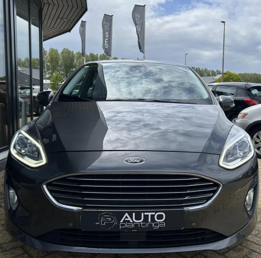 1.0 EcoBoost Titanium 101PK | 1e Eigenaar! | Dealeronderhouden | NL AUTO | AUTOMAAT | Trekhaak | Achteruitrijcamera | B&O Audio | Navigatie | Climate Control | Adaptive Cruise Control | Voor