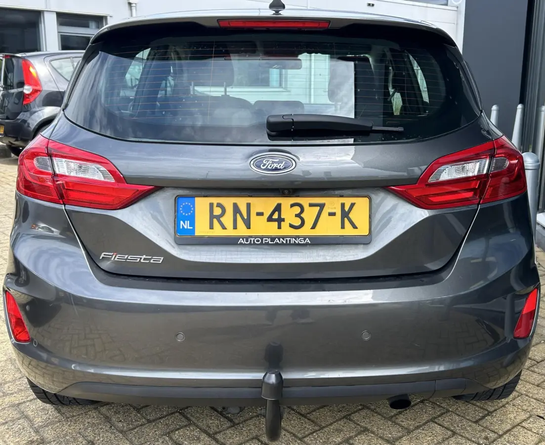 1.0 EcoBoost Titanium 101PK | 1e Eigenaar! | Dealeronderhouden | NL AUTO | AUTOMAAT | Trekhaak | Achteruitrijcamera | B&O Audio | Navigatie | Climate Control | Adaptive Cruise Control | Voor