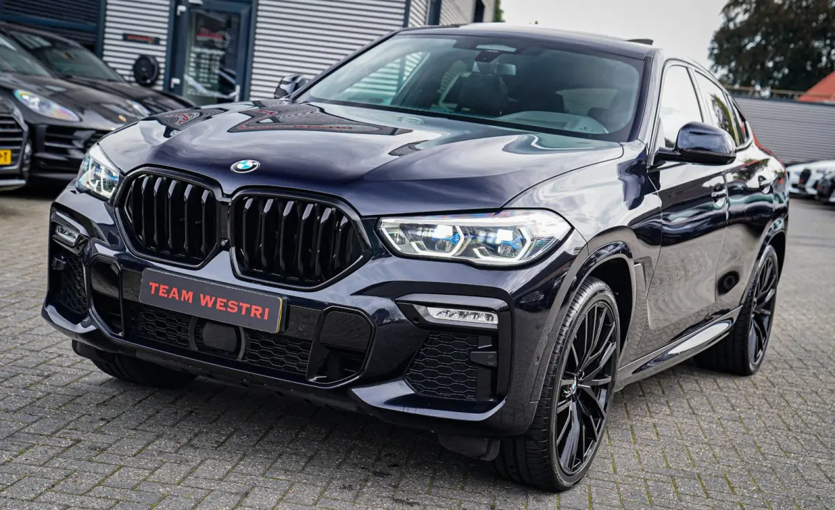 XDrive40i High Executive | Panorama | 360cam | Carbon | Adaptieve cruise control | Kristallen pook | 22 inch | Dealer onder