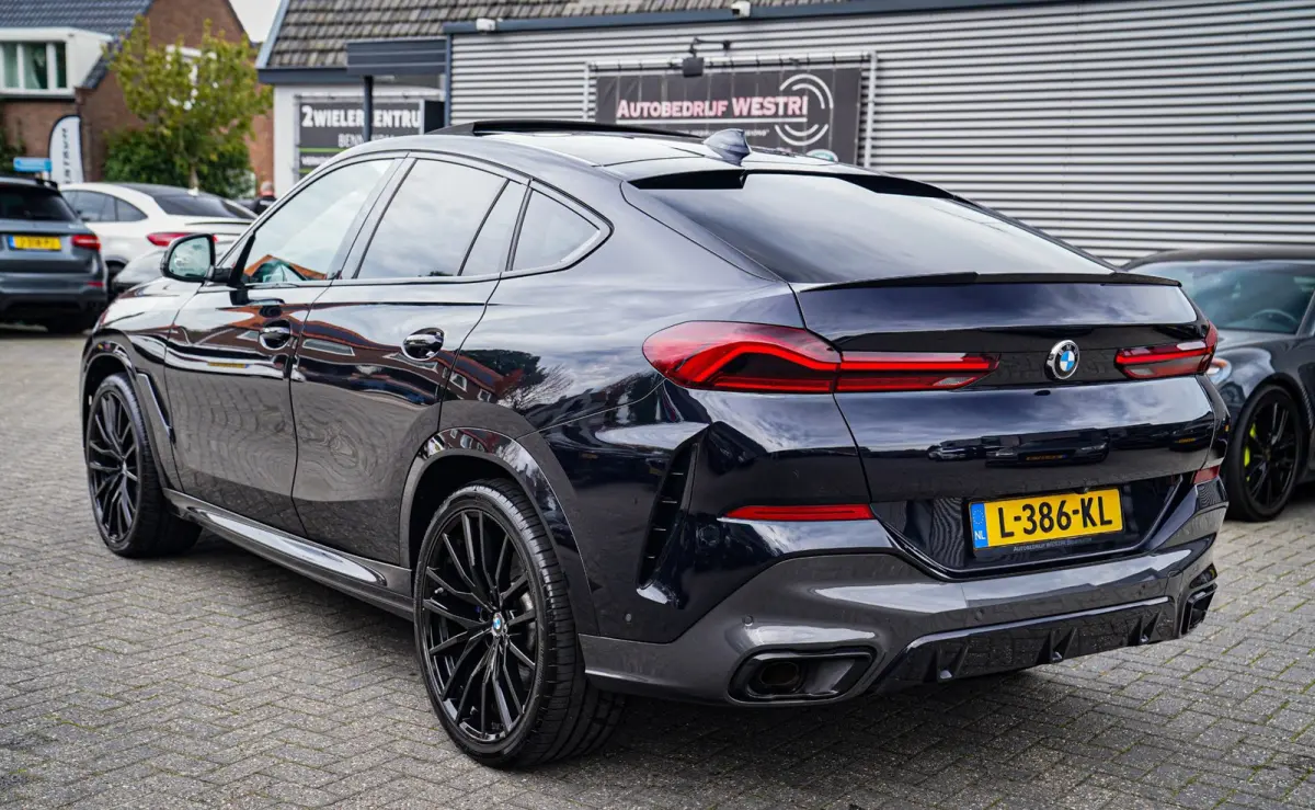 XDrive40i High Executive | Panorama | 360cam | Carbon | Adaptieve cruise control | Kristallen pook | 22 inch | Dealer onder