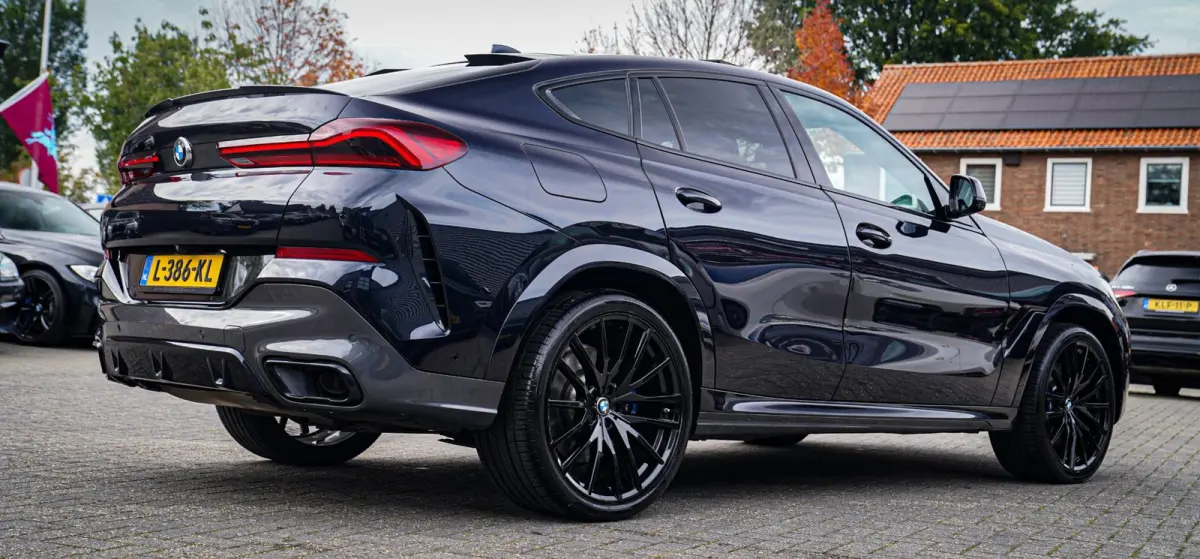 XDrive40i High Executive | Panorama | 360cam | Carbon | Adaptieve cruise control | Kristallen pook | 22 inch | Dealer onder