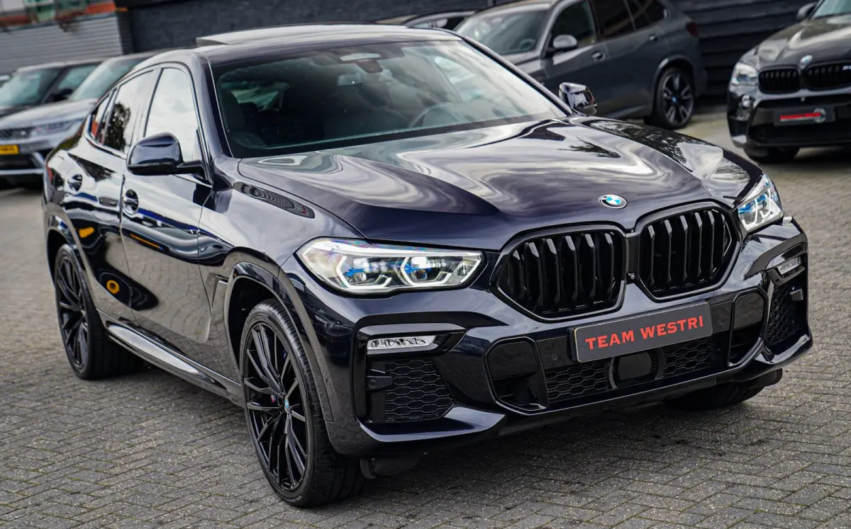 XDrive40i High Executive | Panorama | 360cam | Carbon | Adaptieve cruise control | Kristallen pook | 22 inch | Dealer onder