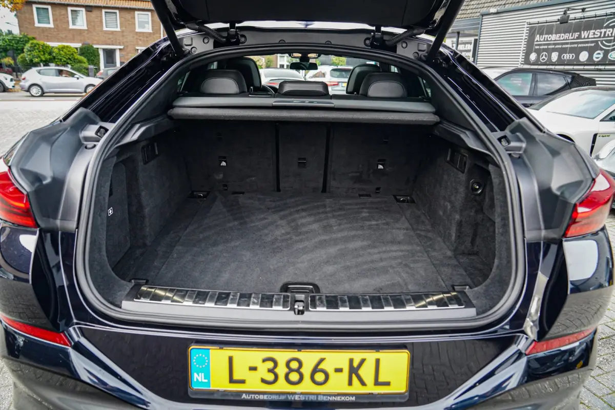 XDrive40i High Executive | Panorama | 360cam | Carbon | Adaptieve cruise control | Kristallen pook | 22 inch | Dealer onder