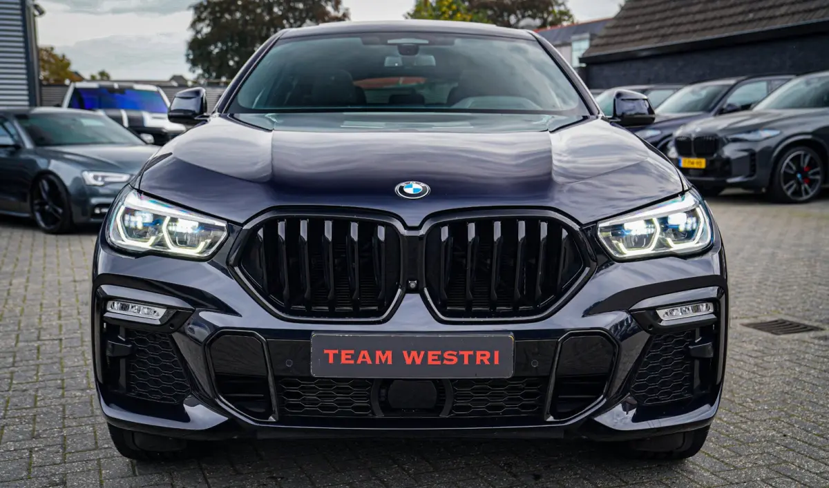 XDrive40i High Executive | Panorama | 360cam | Carbon | Adaptieve cruise control | Kristallen pook | 22 inch | Dealer onder