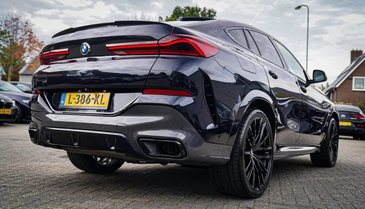 XDrive40i High Executive | Panorama | 360cam | Carbon | Adaptieve cruise control | Kristallen pook | 22 inch | Dealer onder