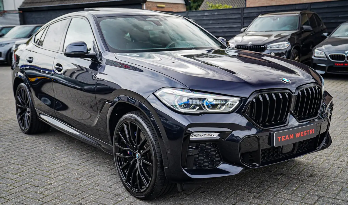 XDrive40i High Executive | Panorama | 360cam | Carbon | Adaptieve cruise control | Kristallen pook | 22 inch | Dealer onder