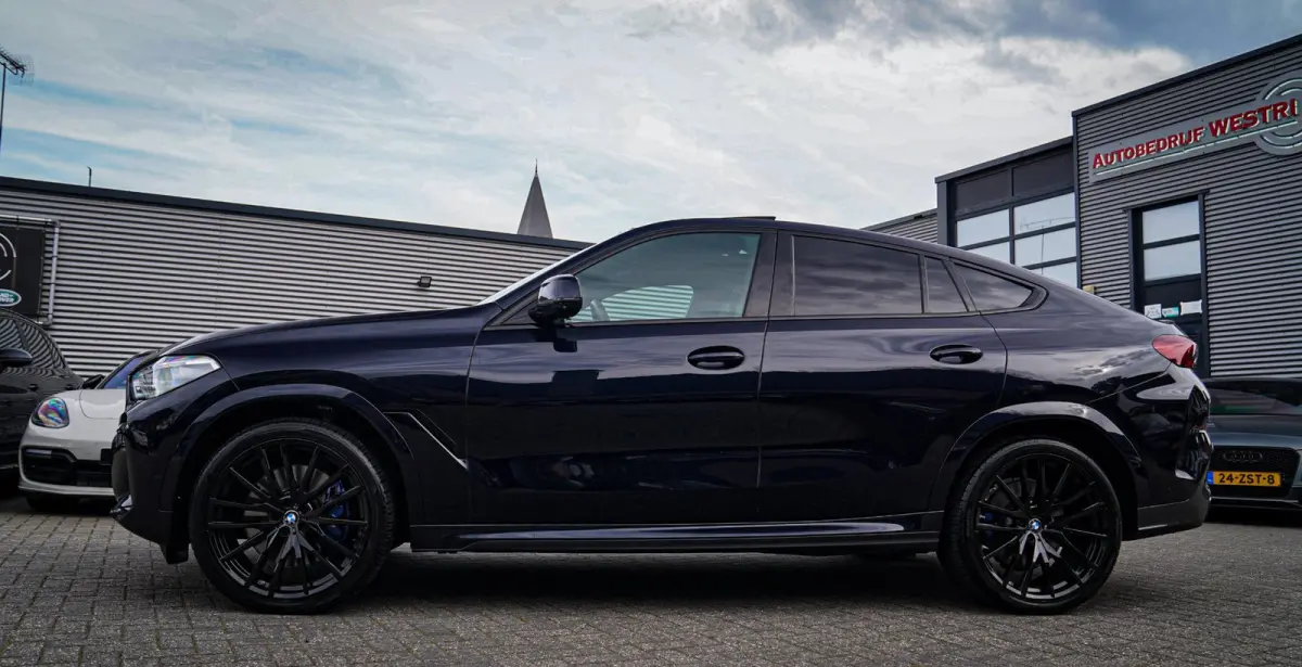 XDrive40i High Executive | Panorama | 360cam | Carbon | Adaptieve cruise control | Kristallen pook | 22 inch | Dealer onder