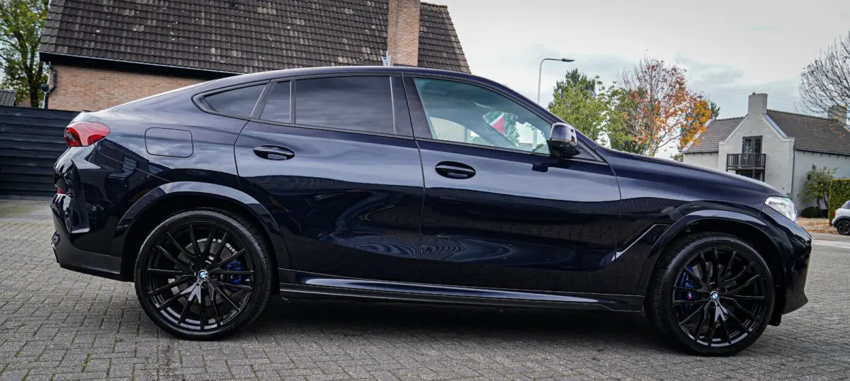 XDrive40i High Executive | Panorama | 360cam | Carbon | Adaptieve cruise control | Kristallen pook | 22 inch | Dealer onder